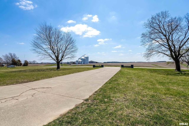 exterior space with a lawn and concrete driveway