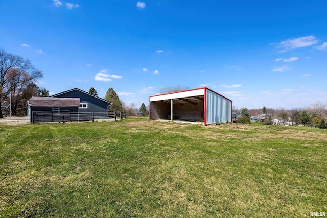 view of yard with an outbuilding and a carport