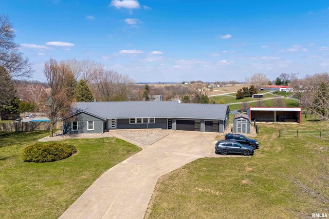 20874 270th St, Eldridge, IA 52748 - single story home featuring a garage, concrete driveway, and metal roof