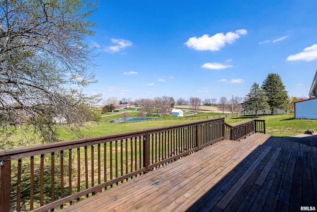deck featuring a lawn