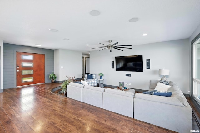 living room featuring recessed lighting, baseboards, a ceiling fan, and wood finished floors