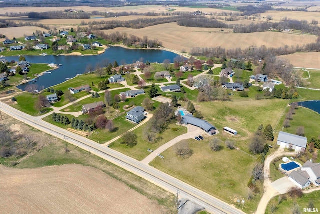 bird's eye view featuring a water view and a residential view