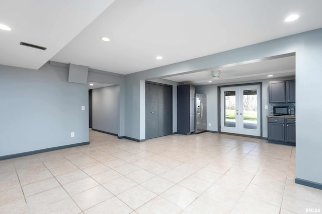 interior space with recessed lighting, french doors, baseboards, and visible vents