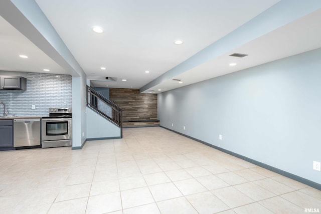 interior space featuring recessed lighting, stairway, visible vents, and baseboards