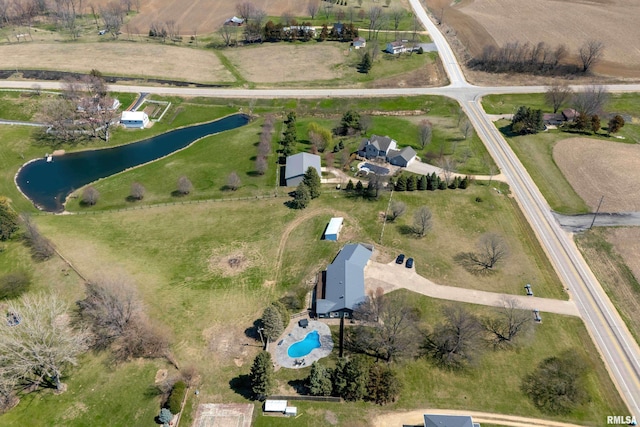 aerial view featuring a rural view and a water view