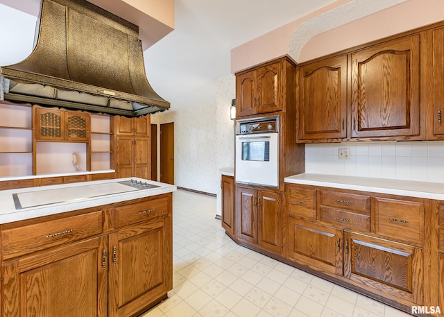 9721 234th St N, Port Byron, IL 61275 - kitchen with open shelves, electric stovetop, white oven, custom range hood, and light flooring