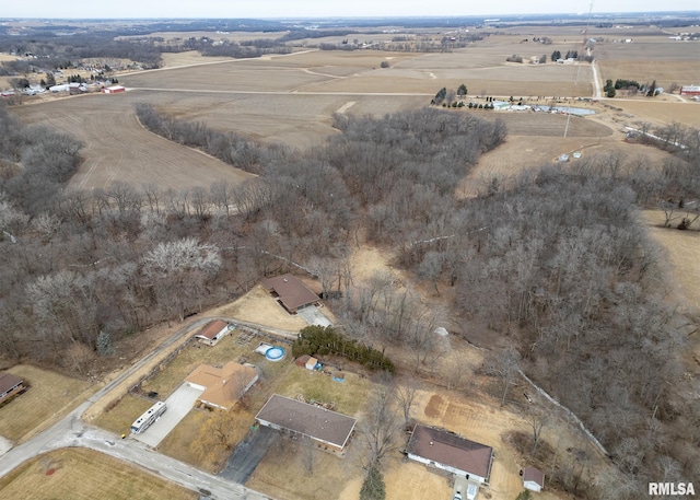 birds eye view of property with a rural view