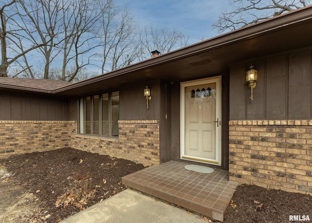 entrance to property with brick siding