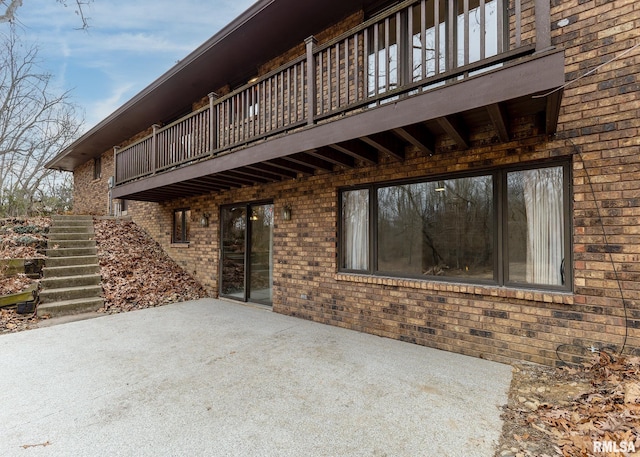 view of patio / terrace featuring stairs