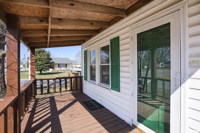 wooden terrace with a residential view