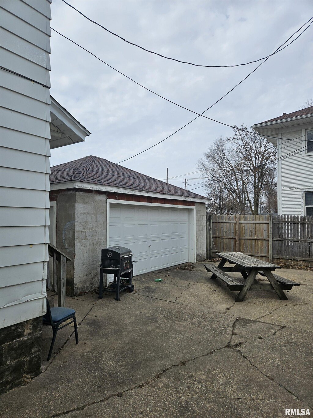 garage featuring fence