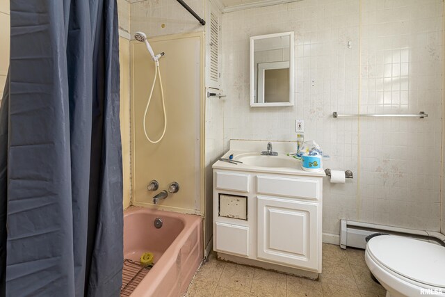 1500 W Tyler St, Herrin, IL 62948 - full bath with vanity, tile walls, shower / bathtub combination with curtain, and baseboard heating