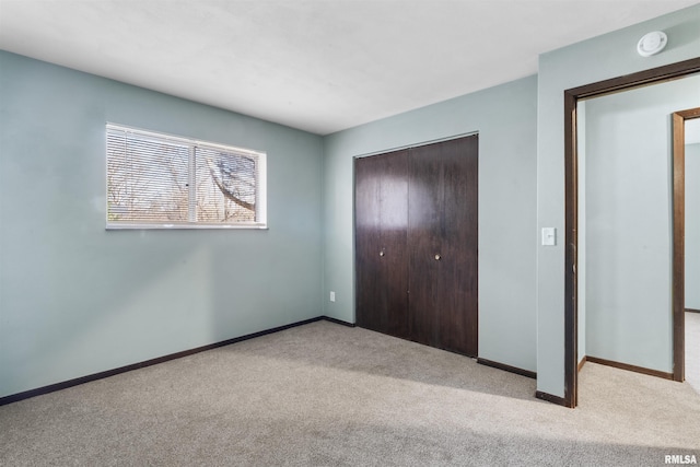 2501 26th Avenue Ct, Rock Island, IL 61201 - unfurnished bedroom with a closet, baseboards, and carpet