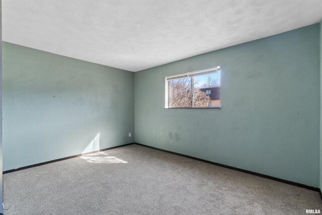 2501 26th Avenue Ct, Rock Island, IL 61201 - carpeted empty room featuring baseboards