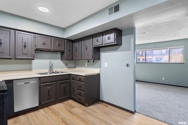 2501 26th Avenue Ct, Rock Island, IL 61201 - kitchen with visible vents, baseboards, dishwasher, light countertops, and a sink