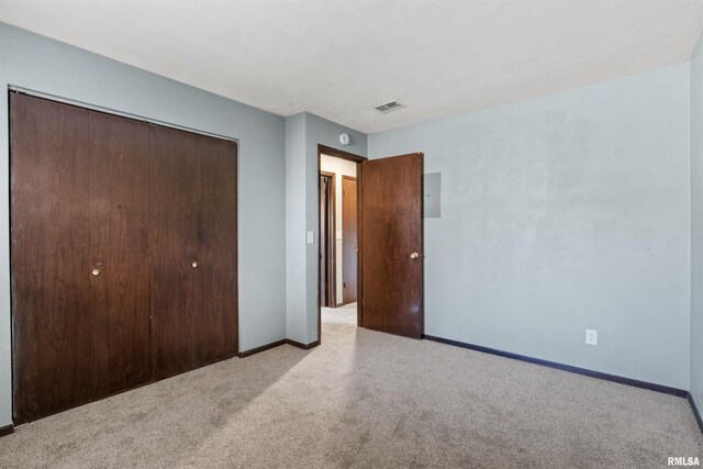 2501 26th Avenue Ct, Rock Island, IL 61201 - unfurnished bedroom with visible vents, carpet flooring, baseboards, and a closet