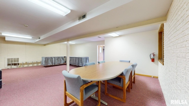 carpeted dining room featuring visible vents