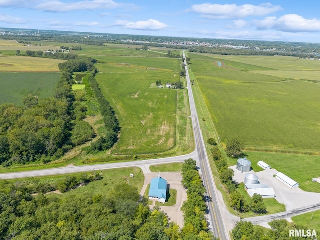 birds eye view of property with a rural view