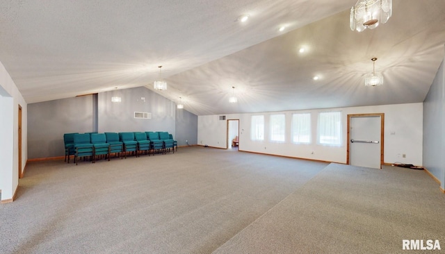 interior space featuring visible vents, lofted ceiling, baseboards, and carpet flooring