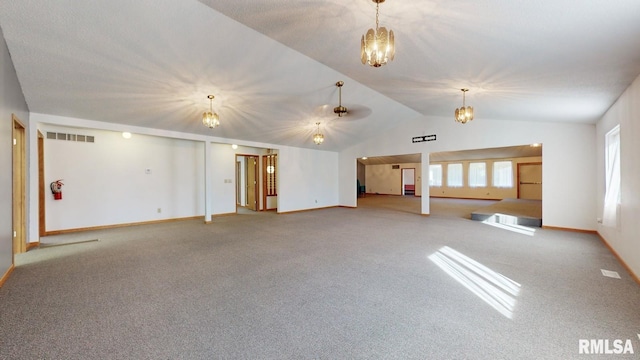 unfurnished living room with visible vents, baseboards, carpet floors, vaulted ceiling, and a notable chandelier