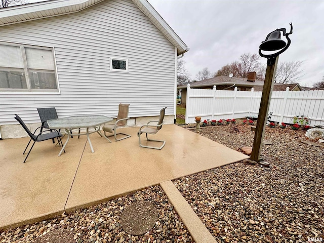view of patio featuring fence