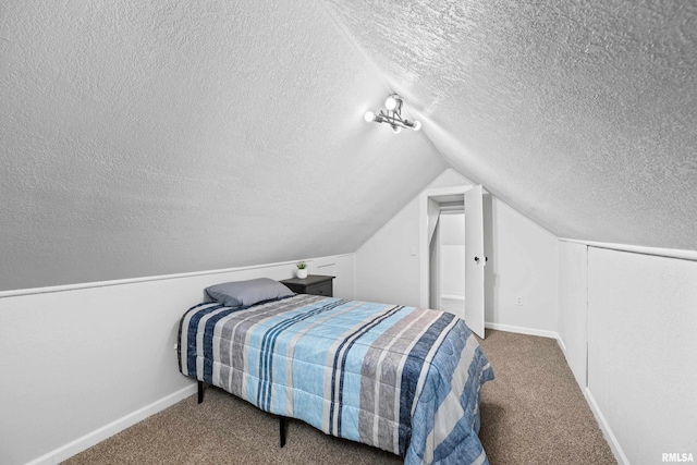 carpeted bedroom with baseboards, a textured ceiling, and vaulted ceiling