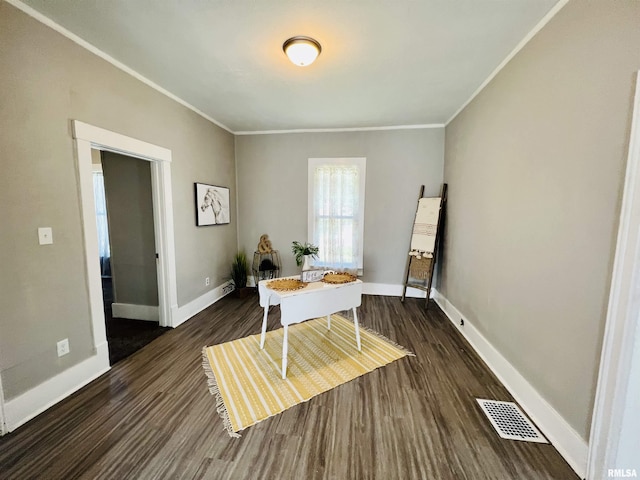 dining space featuring crown molding, baseboards, visible vents, and dark wood-type flooring