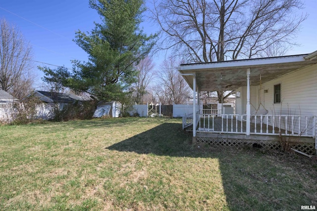 view of yard with an outbuilding, a storage unit, and a fenced backyard
