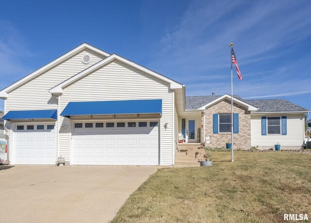 ranch-style home with brick siding, driveway, a front yard, and an attached garage