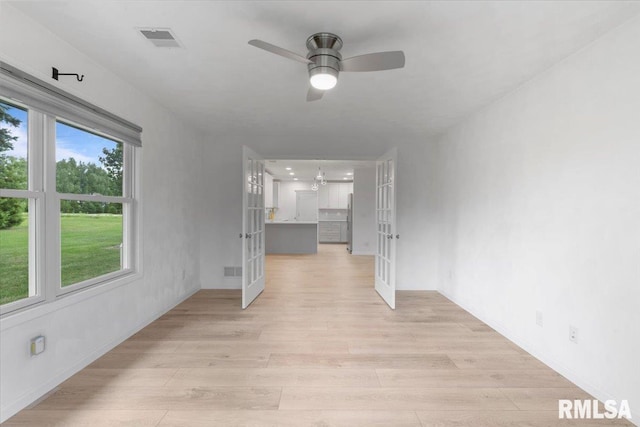 19109 Bluff Rd Unit D, Geneseo, IL 61254 - unfurnished room with french doors, light wood-type flooring, and a ceiling fan