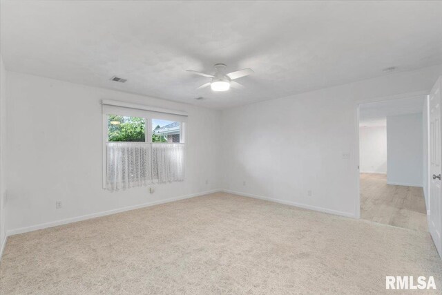 19109 Bluff Rd Unit D, Geneseo, IL 61254 - spare room featuring light carpet and a ceiling fan