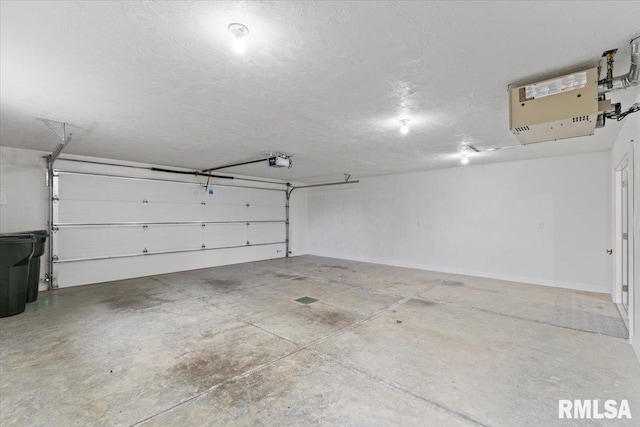 19109 Bluff Rd Unit D, Geneseo, IL 61254 - garage featuring a garage door opener and a heating unit