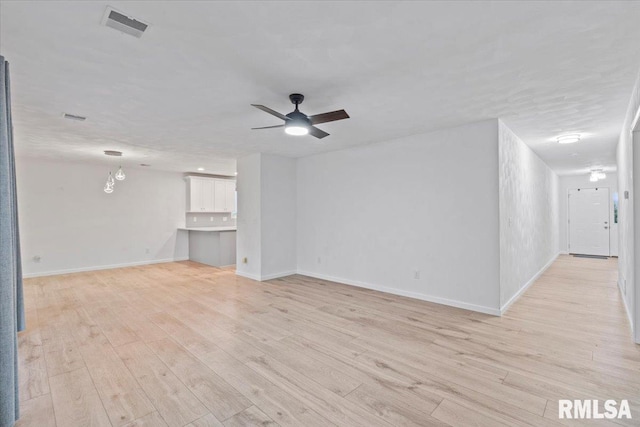 19109 Bluff Rd Unit D, Geneseo, IL 61254 - unfurnished living room with light wood-type flooring and ceiling fan
