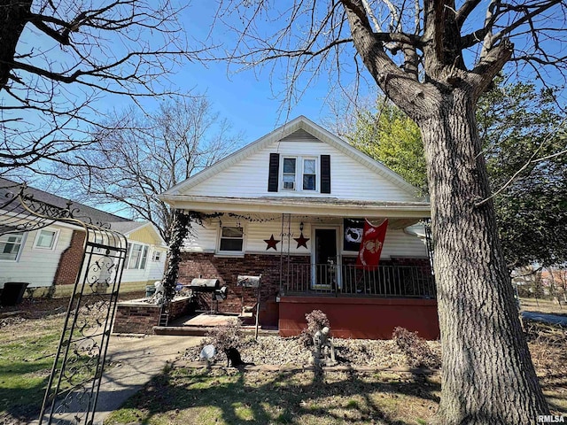 1001 S 14th St, Herrin, IL 62948 - bungalow featuring brick siding and a porch