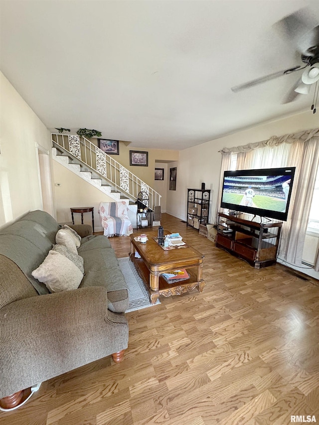 1001 S 14th St, Herrin, IL 62948 - living room featuring stairs, wood finished floors, and a ceiling fan