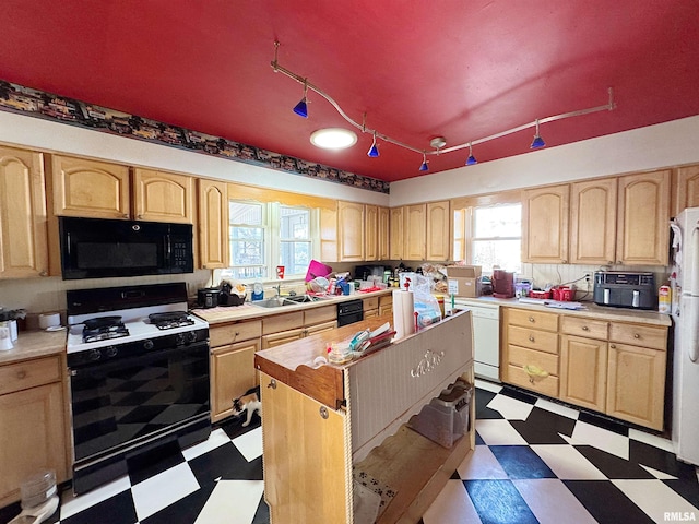 1001 S 14th St, Herrin, IL 62948 - kitchen with white appliances, light countertops, light brown cabinets, and dark floors