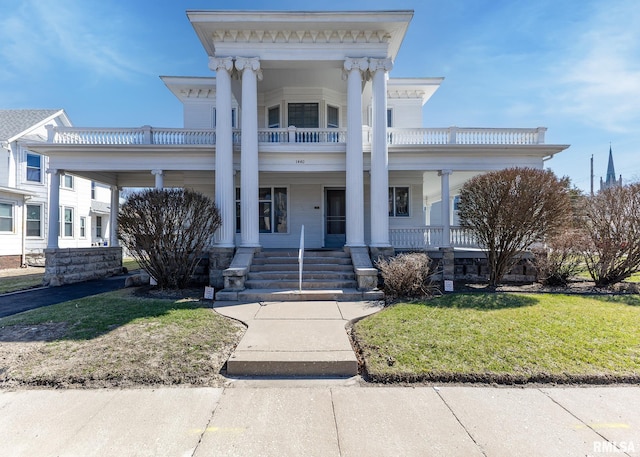 1440 12th St, Moline, IL 61265 - american foursquare style home featuring a front lawn and covered porch
