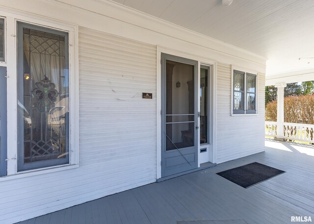 1440 12th St, Moline, IL 61265 - view of exterior entry featuring a balcony and a porch