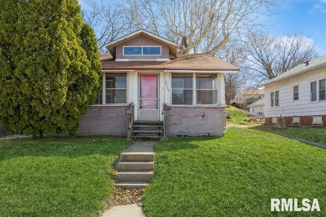 4227 11th St, Rock Island, IL 61201 - bungalow-style house with a front yard and entry steps