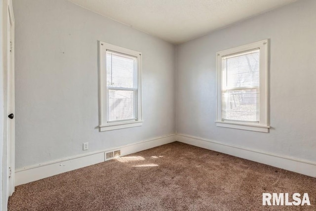 4227 11th St, Rock Island, IL 61201 - carpeted empty room with visible vents
