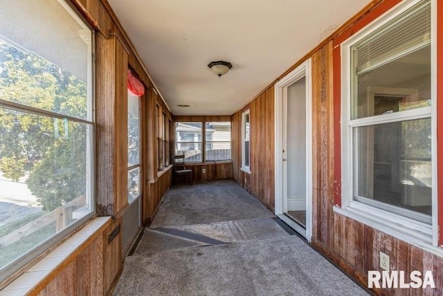 4227 11th St, Rock Island, IL 61201 - sunroom / solarium featuring carpet and wood walls