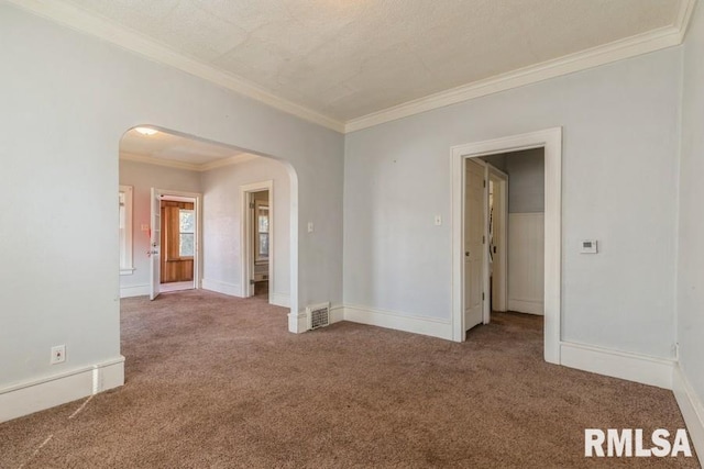 4227 11th St, Rock Island, IL 61201 - empty room with arched walkways, carpet flooring, visible vents, and baseboards