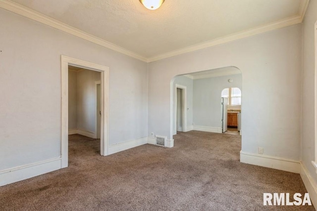 4227 11th St, Rock Island, IL 61201 - unfurnished room featuring arched walkways, carpet flooring, visible vents, and crown molding