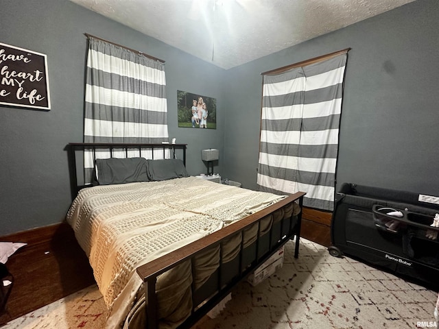 121 E Church St, Galatia, IL 62935 - bedroom featuring a textured ceiling and wood finished floors