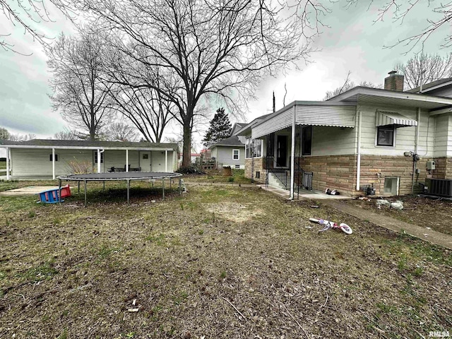 121 E Church St, Galatia, IL 62935 - view of yard with a trampoline and central AC unit