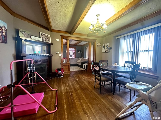121 E Church St, Galatia, IL 62935 - dining room with a wealth of natural light, an inviting chandelier, beam ceiling, and hardwood / wood-style floors