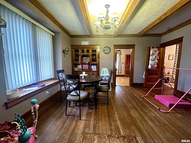 121 E Church St, Galatia, IL 62935 - dining space with baseboards, a notable chandelier, beam ceiling, and hardwood / wood-style flooring
