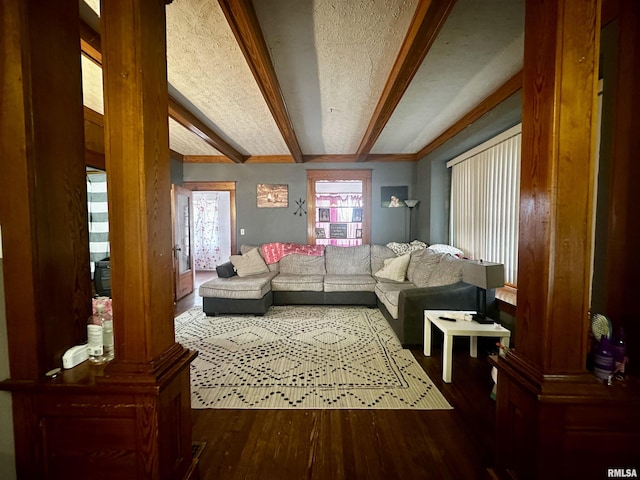 121 E Church St, Galatia, IL 62935 - living room featuring beamed ceiling, wood finished floors, and a textured ceiling
