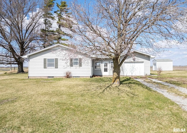 10415 148th Ave, Orion, IL 61273 - back of property featuring dirt driveway, a lawn, and a garage