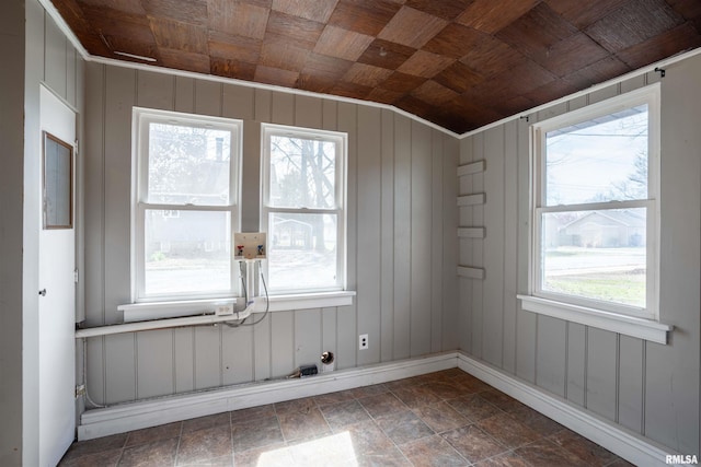 spare room with vaulted ceiling and wooden ceiling